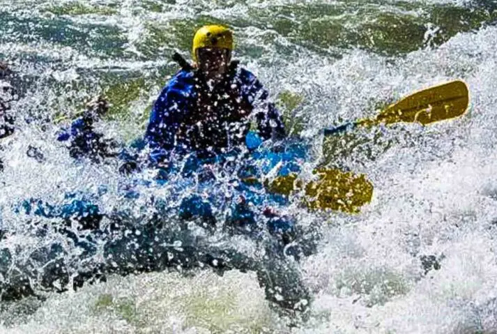 Three people whitewater rafting in Idaho.