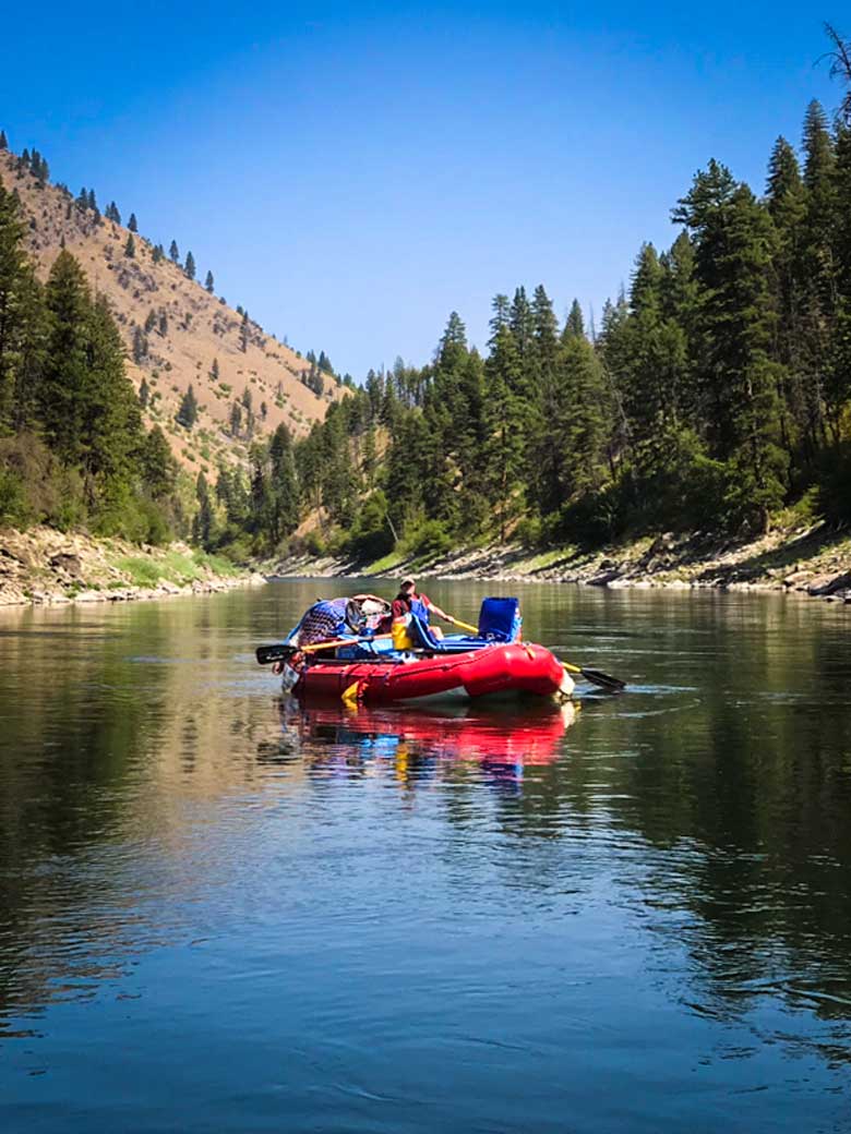 A man rafting during a Main Salmon River whitewater rafting vacation in Idaho.