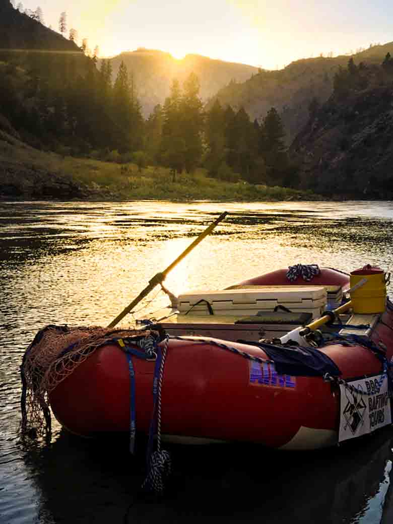 A raft in great condition at sunset at camp during a Main Salmon River whitewater rafting vacation in Idaho.