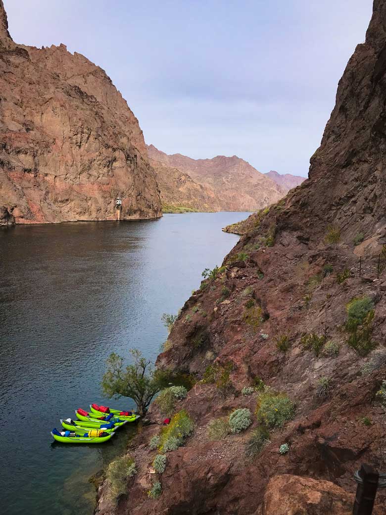View of four kayaks on the Colorado River during a kayak trip on the Colorado River in Arizona near the Grand Canyon National Park.