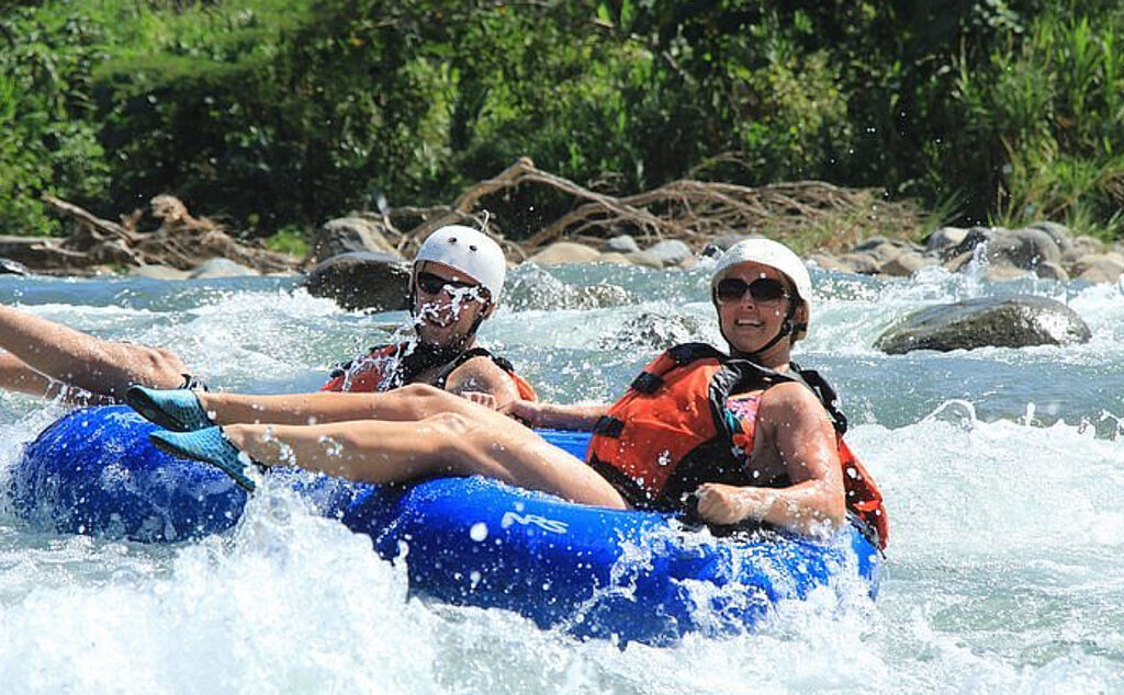 Splashing through rapids while tubing on the Provo River. provo-river-tubing